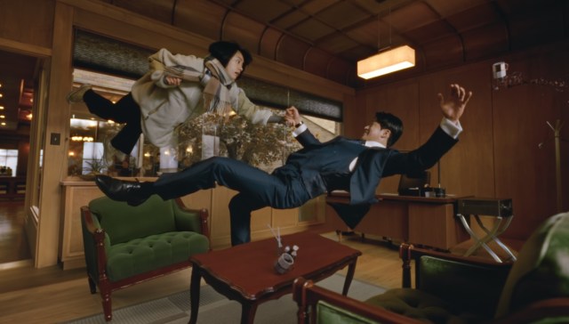 A scene from 2025 Japanese drama "Romantics Anonymous," featuring Oguri Shun and Han Hyo Joo falling dramatically.